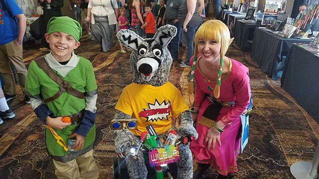 Children in costume standing next to Wilbur cosplayer